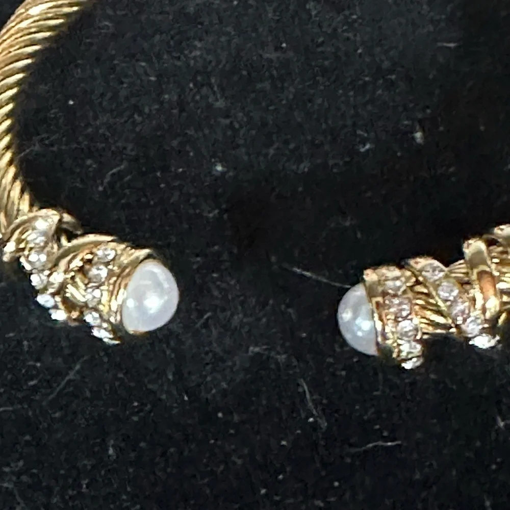 - Sophisticated Gold Bracelet. Titanium with pear colored stones & clear stone